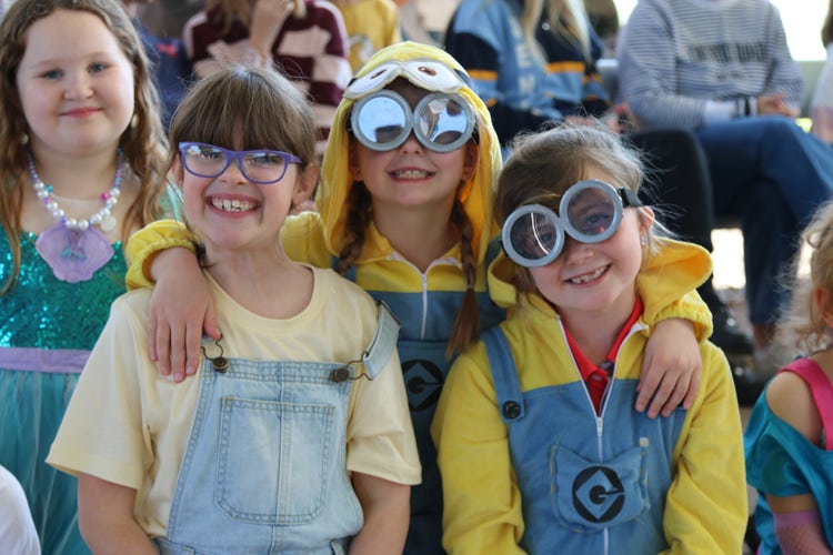 # students dressed as minions sitting with their class